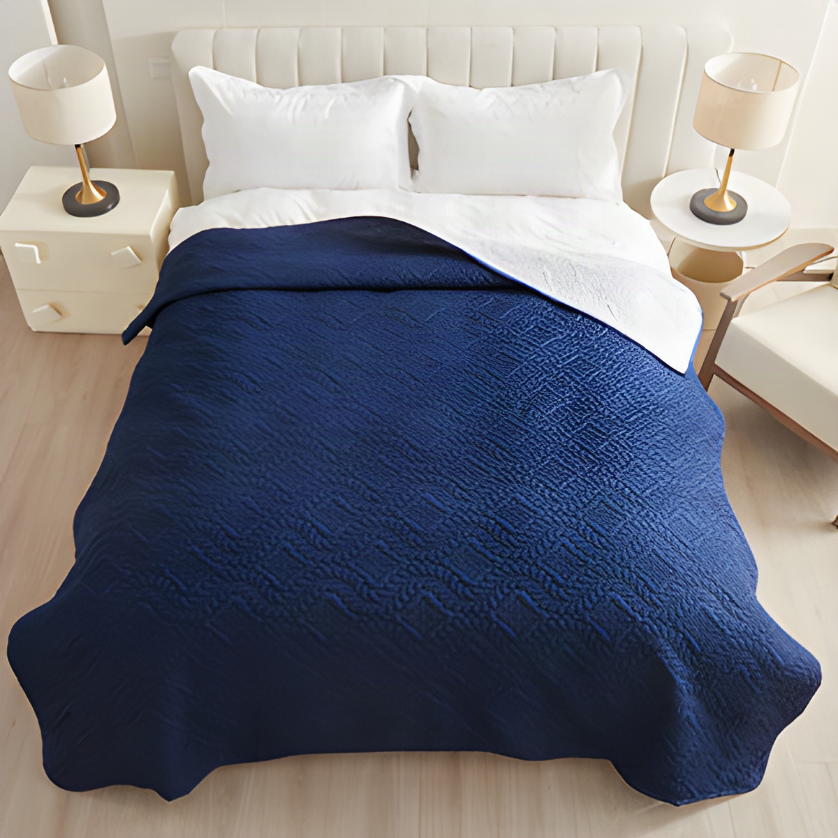 Navy waterproof quilted dog blanket spread over a bed