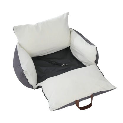 Travel car seat bed with the cushion unfolded showing the dark base