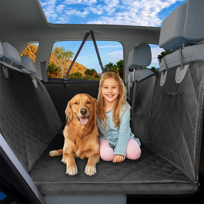 Golden retriever and child sitting on a back seat extender platform with side flaps