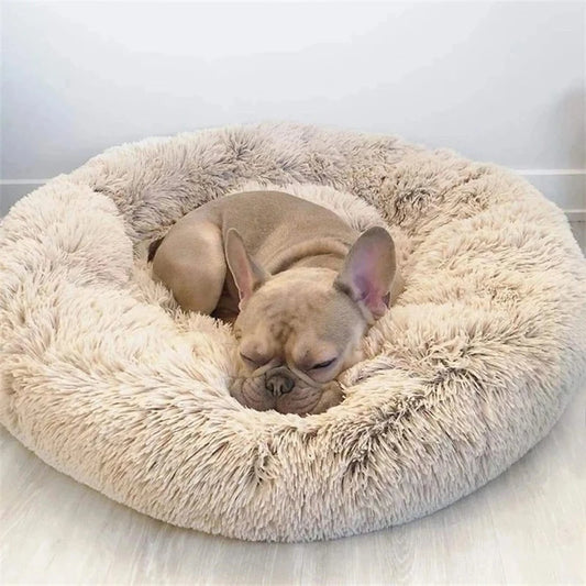 Round beige plush donut dog bed