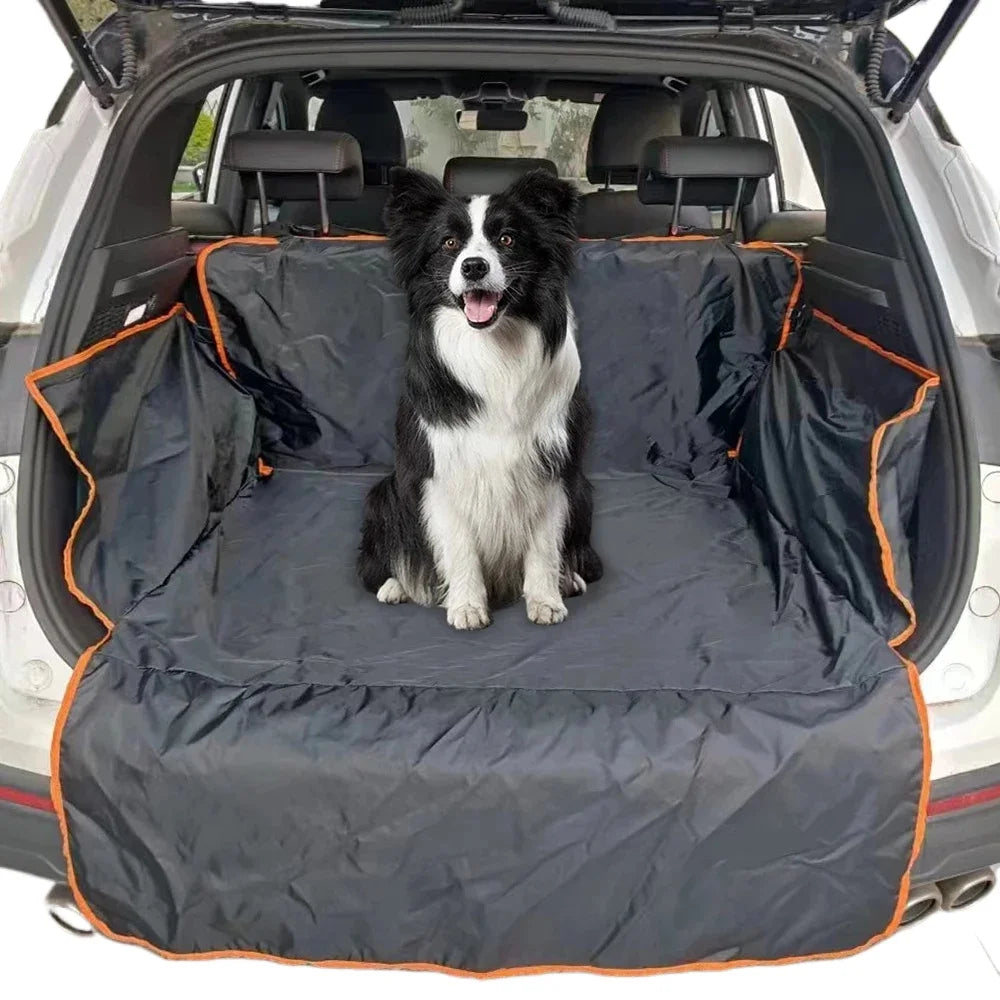 Border collie sitting on the SUV boot liner with side walls and bumper flap in a car boot