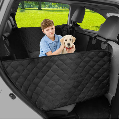 Black quilted back seat extender hammock in a car with a child and a small dog