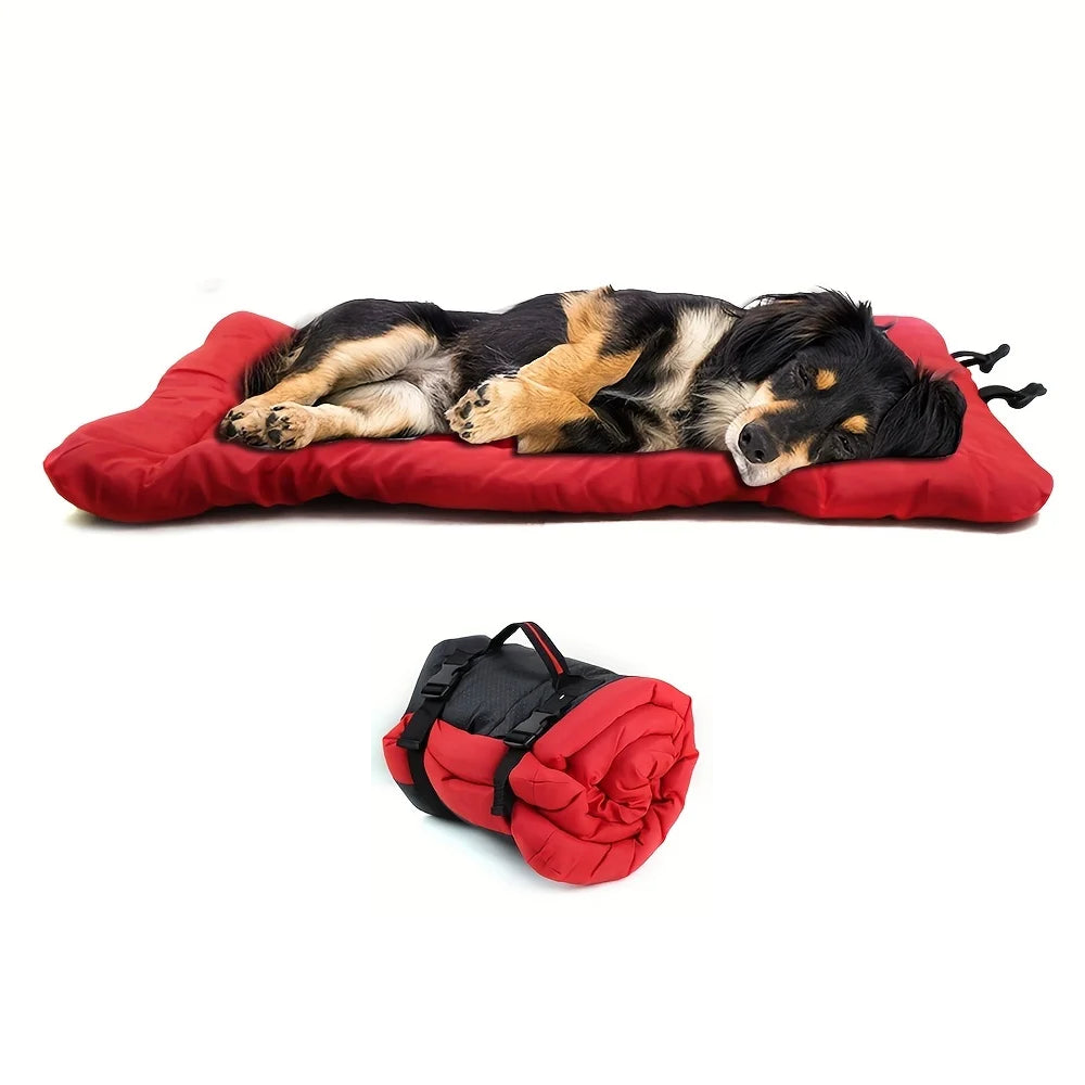 Red roll-up waterproof dog travel mat laid flat with a dog, and rolled up with buckle straps